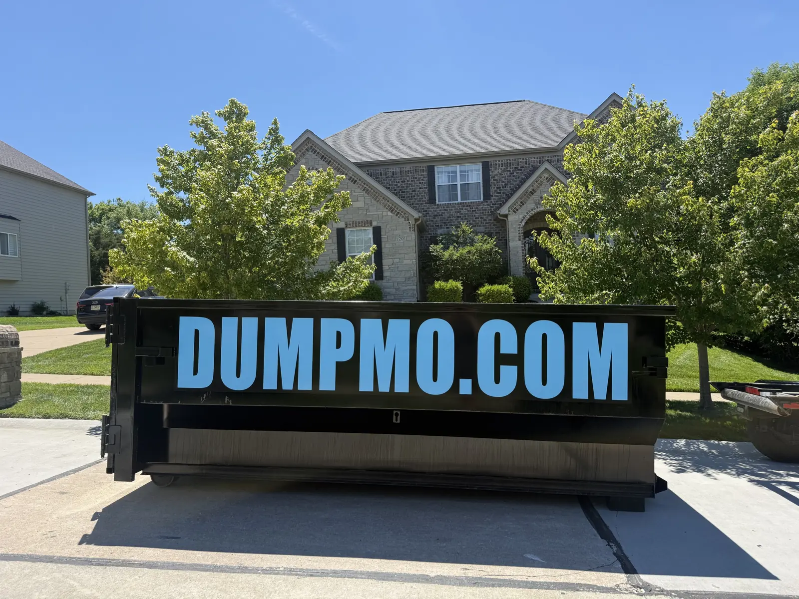 Dump Mo branded roll-off dumpster